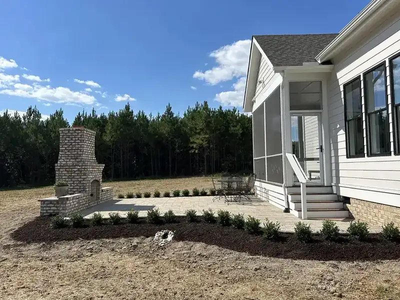 Paver patio and outdoor fireplace hardscape installation